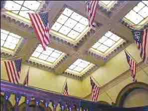 Flags hang from the top floor of the courthouse